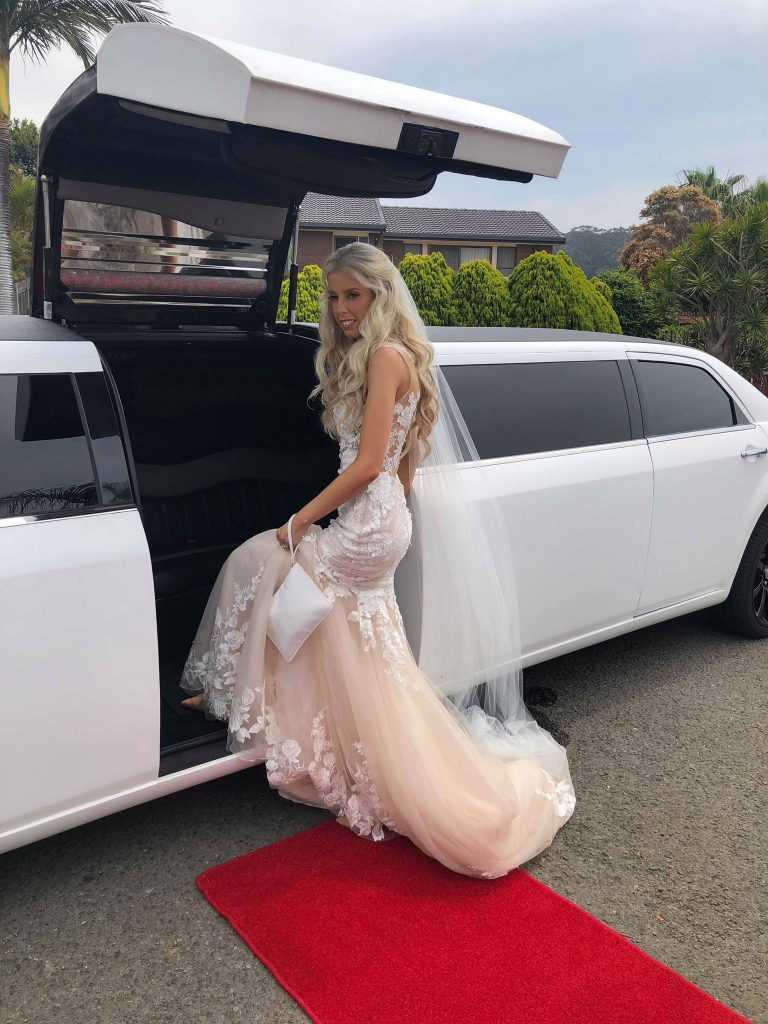 bride entering stretch limo